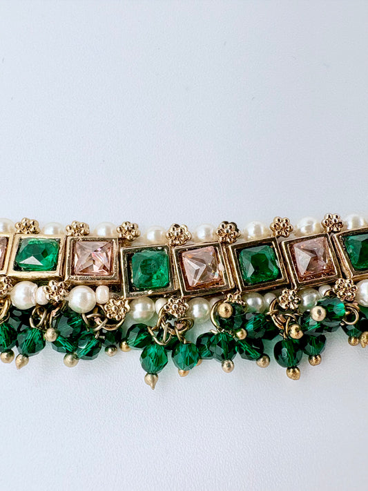 Choker necklace with green gemstones, pearls, and gold accents available at Nishaani.ca – Indian jewelry in Canada