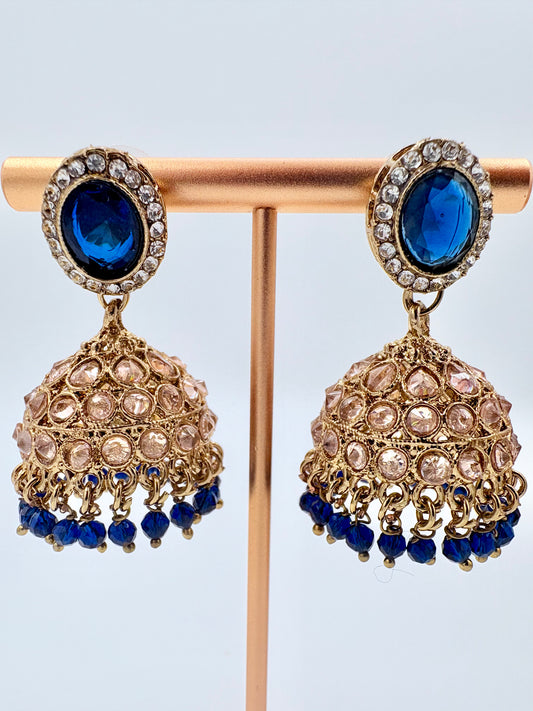 Pair of gold and blue earrings on a stand available at Nishaani.ca – Indian jewelry in Canada