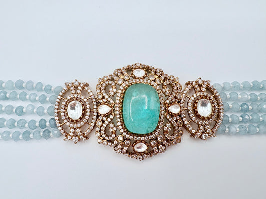 Choker necklace set with turquoise stone and gold accents available at Nishaani.ca – Indian jewelry in Canada