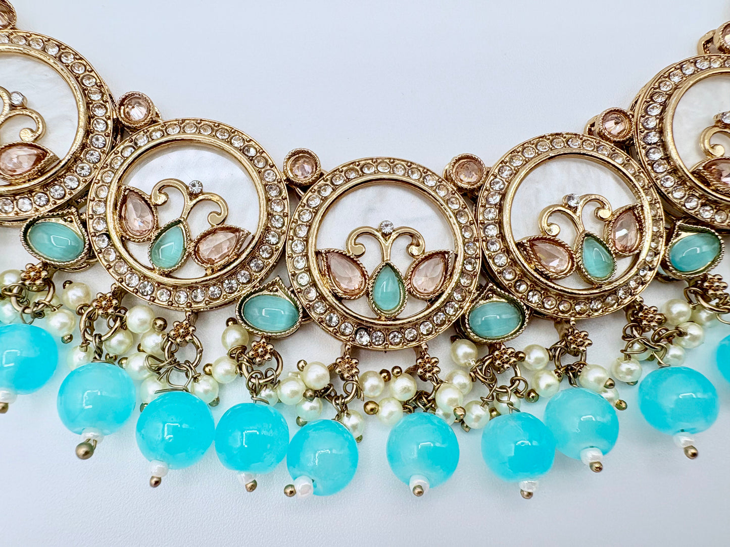 Ornate necklace with turquoise beads and gold accents available at Nishaani.ca – Indian jewelry in Canada