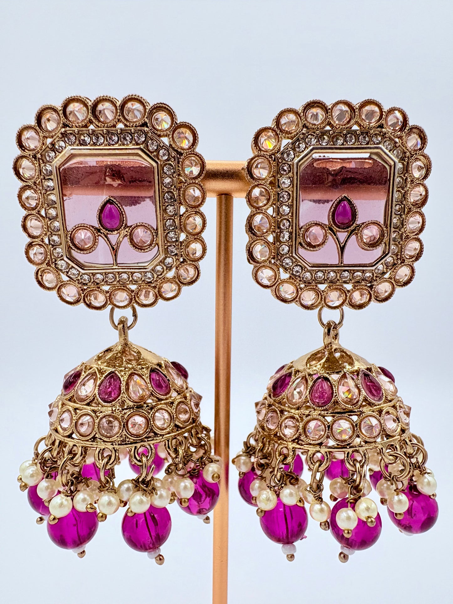 Ornate earrings with pink and gold details available at Nishaani.ca – Indian jewelry in Canada