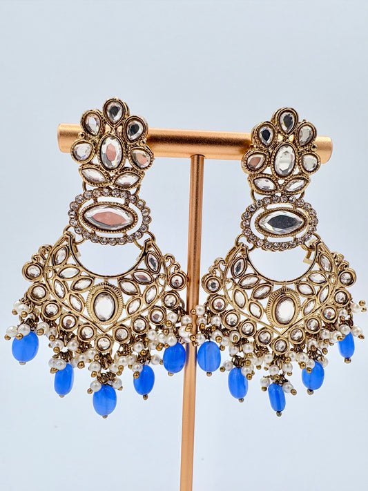Ornate gold earrings with blue stones available at Nishaani.ca – Indian jewelry in Canada