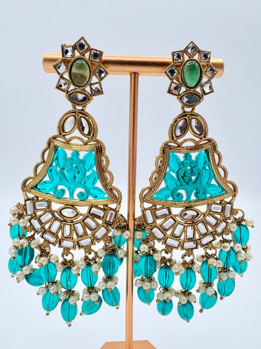 Ornate turquoise earrings with gold and pearl accents available at Nishaani.ca – Indian jewelry in Canada