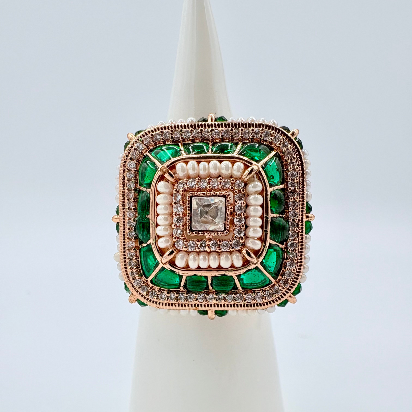 Decorative ring with green and rose gold accents available at Nishaani.ca – Indian jewelry in Canada