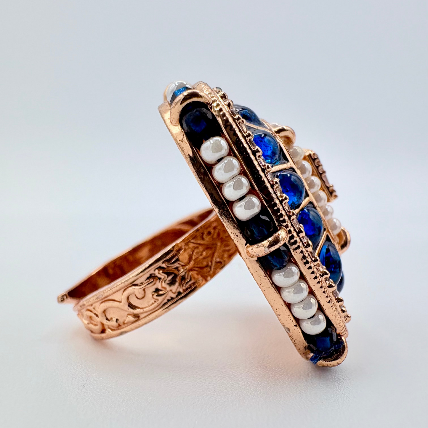 Side View Rose gold ring with blue gemstones and pearls available at Nishaani.ca – Indian jewelry in Canada