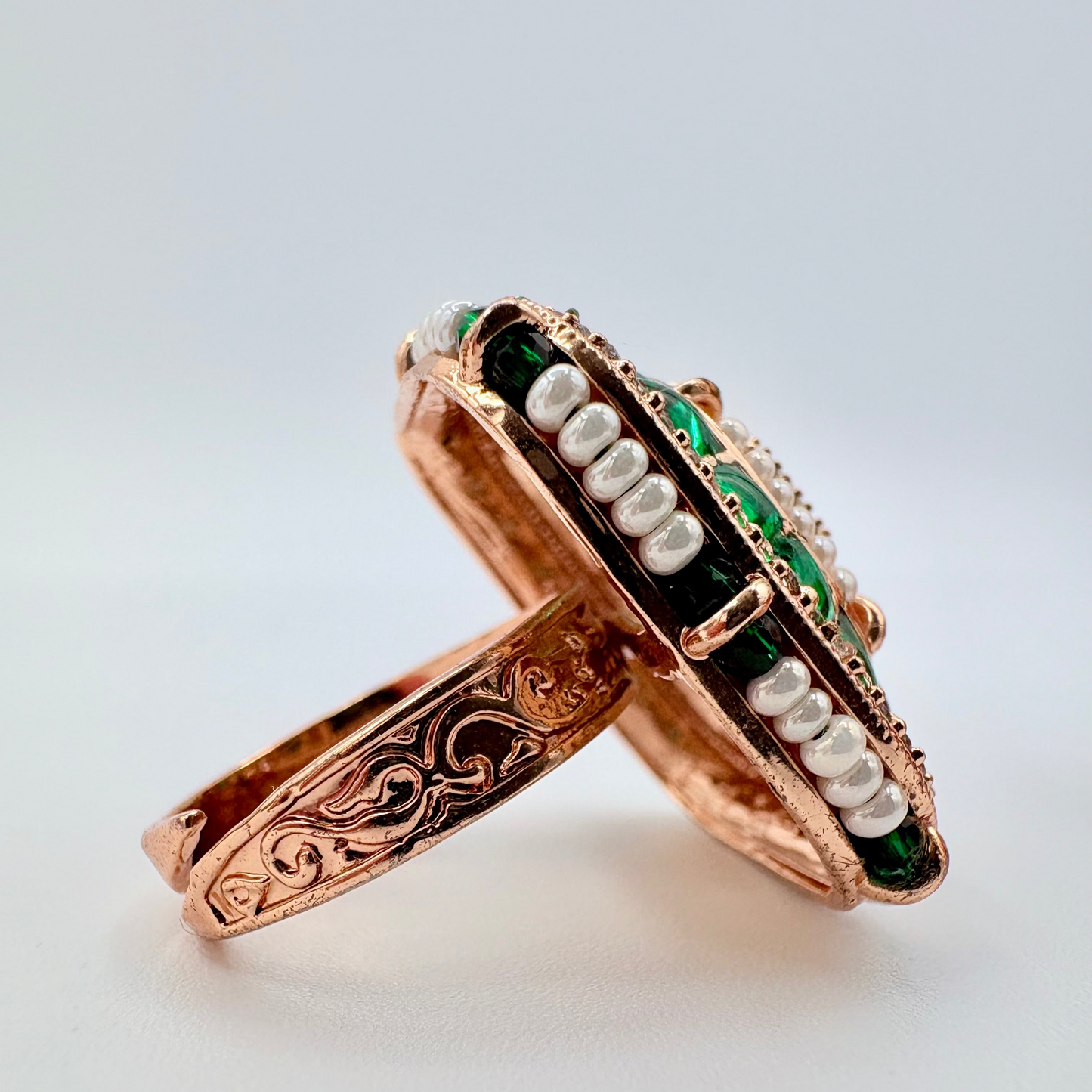 Rose gold ring with green and white gemstones available at Nishaani.ca – Indian jewelry in Canada
