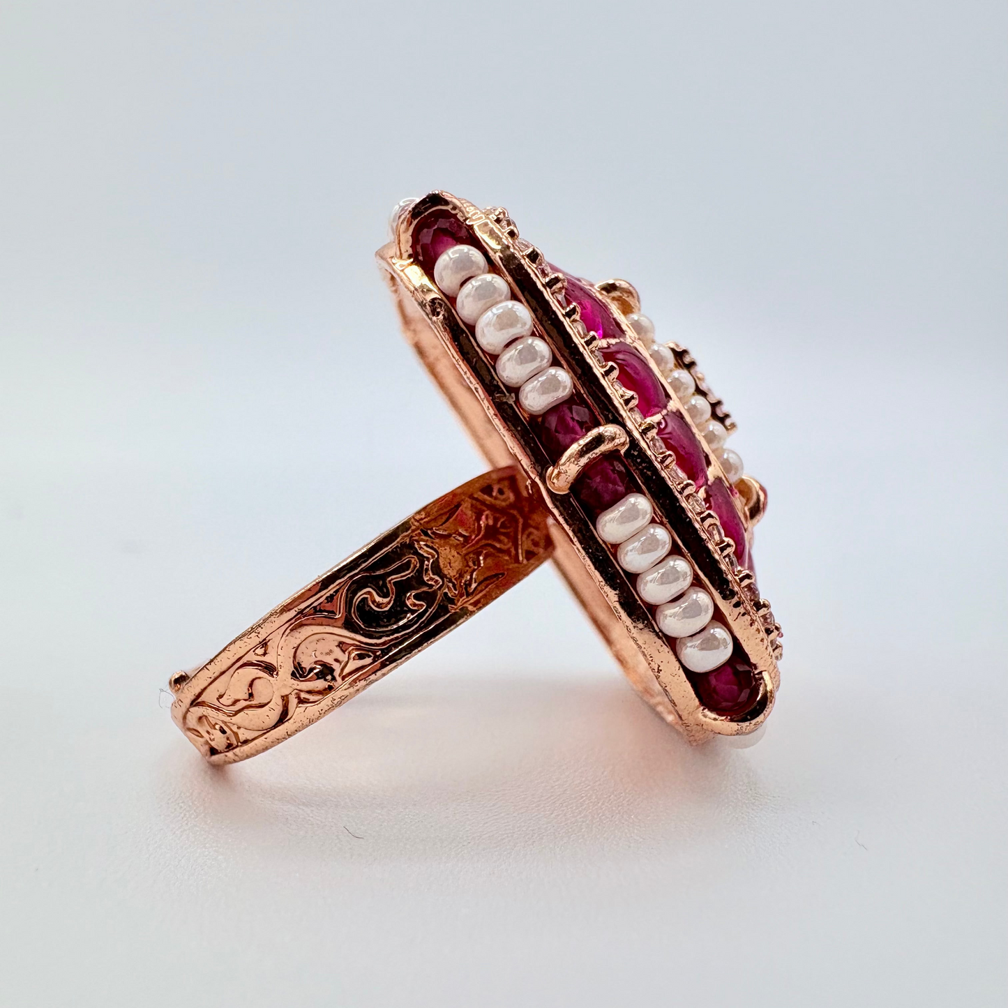 Rose gold ring with embedded gemstones available at Nishaani.ca – Indian jewelry in Canada