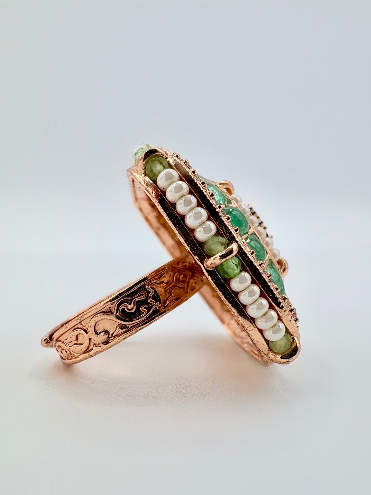 Rose gold ring with green and white stones available at Nishaani.ca – Indian jewelry in Canada