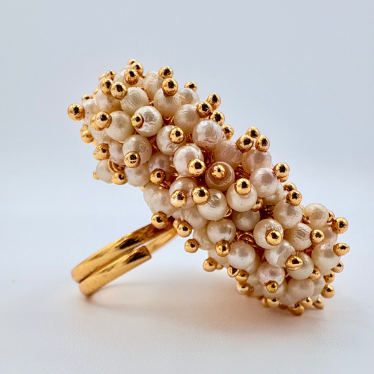 Side view Indian adjustable ring with gold and beige beads centre gold flower available at Nishaani.ca – Indian jewelry