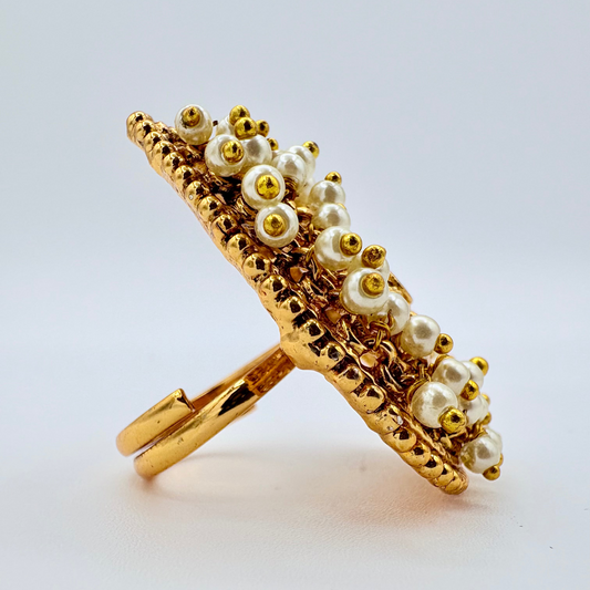 Gold ring with pearls on a light available at Nishaani.ca – Indian jewelry in Canada