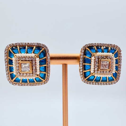 Gold earrings with blue gemstones available at Nishaani.ca – Indian jewelry in Canada