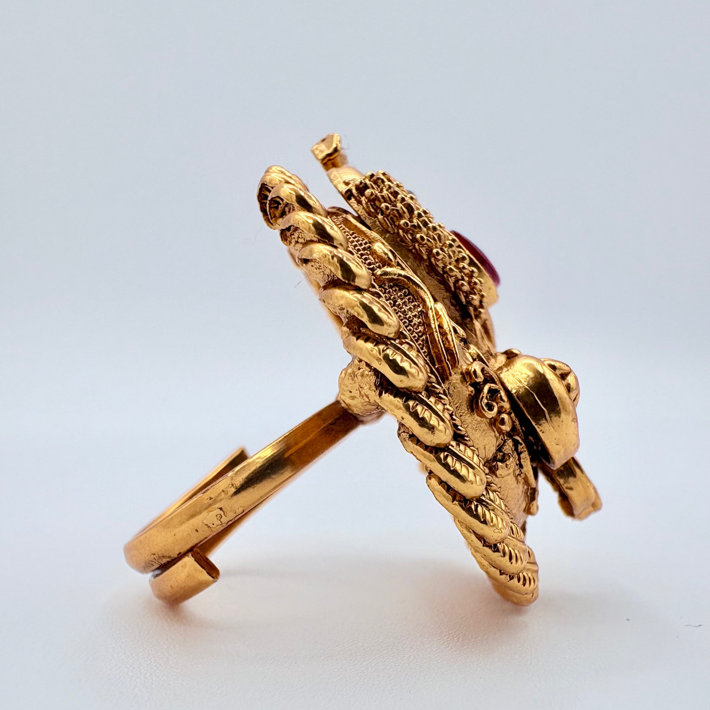 Gold ring with intricate design available at Nishaani.ca – Indian jewelry in Canada