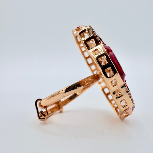 Rose gold ring with a red gemstone available at Nishaani.ca – Indian jewelry in Canada