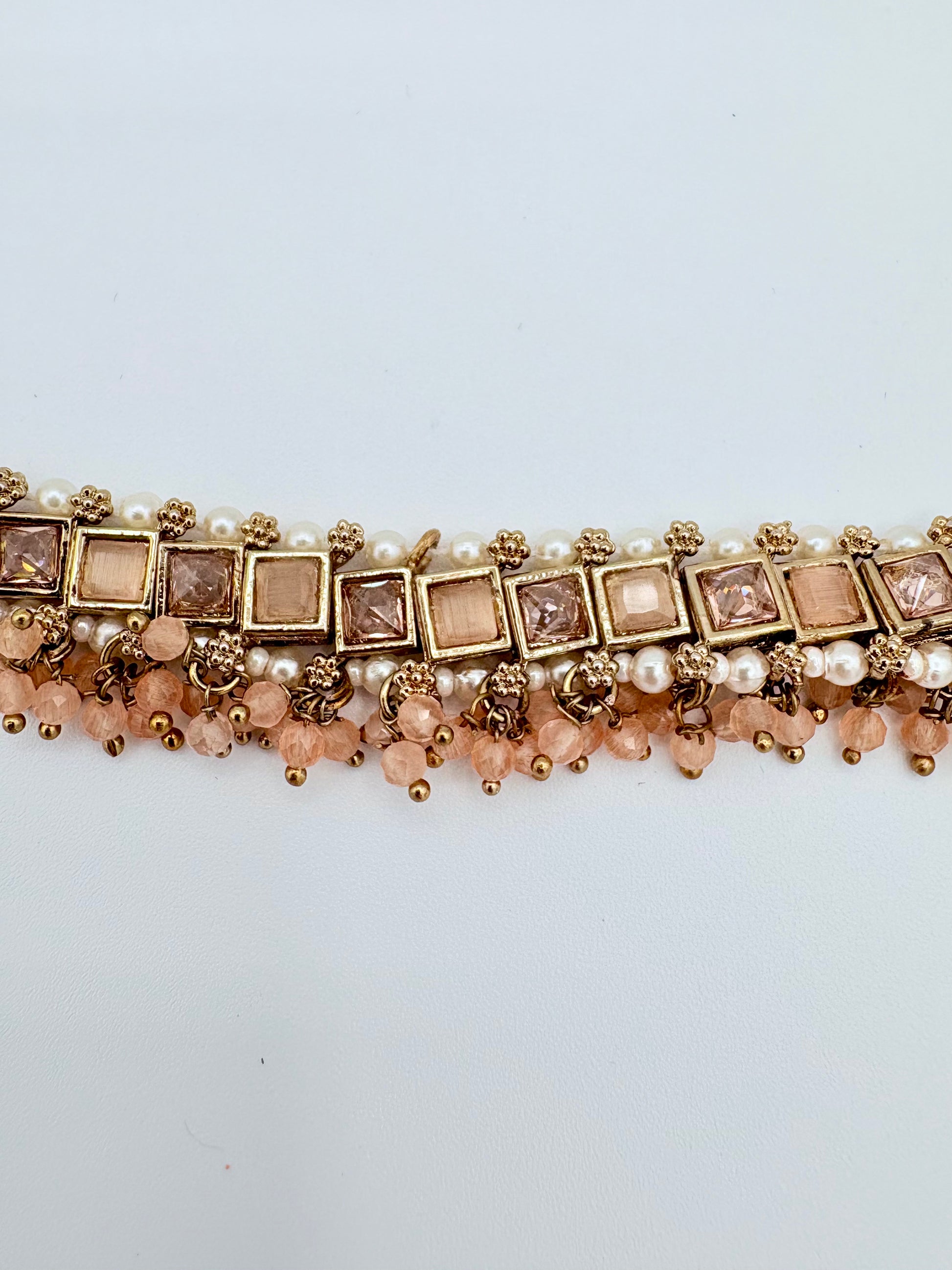 Choker necklace with gold, pearl, and pink bead design available at Nishaani.ca – Indian jewelry in Canada