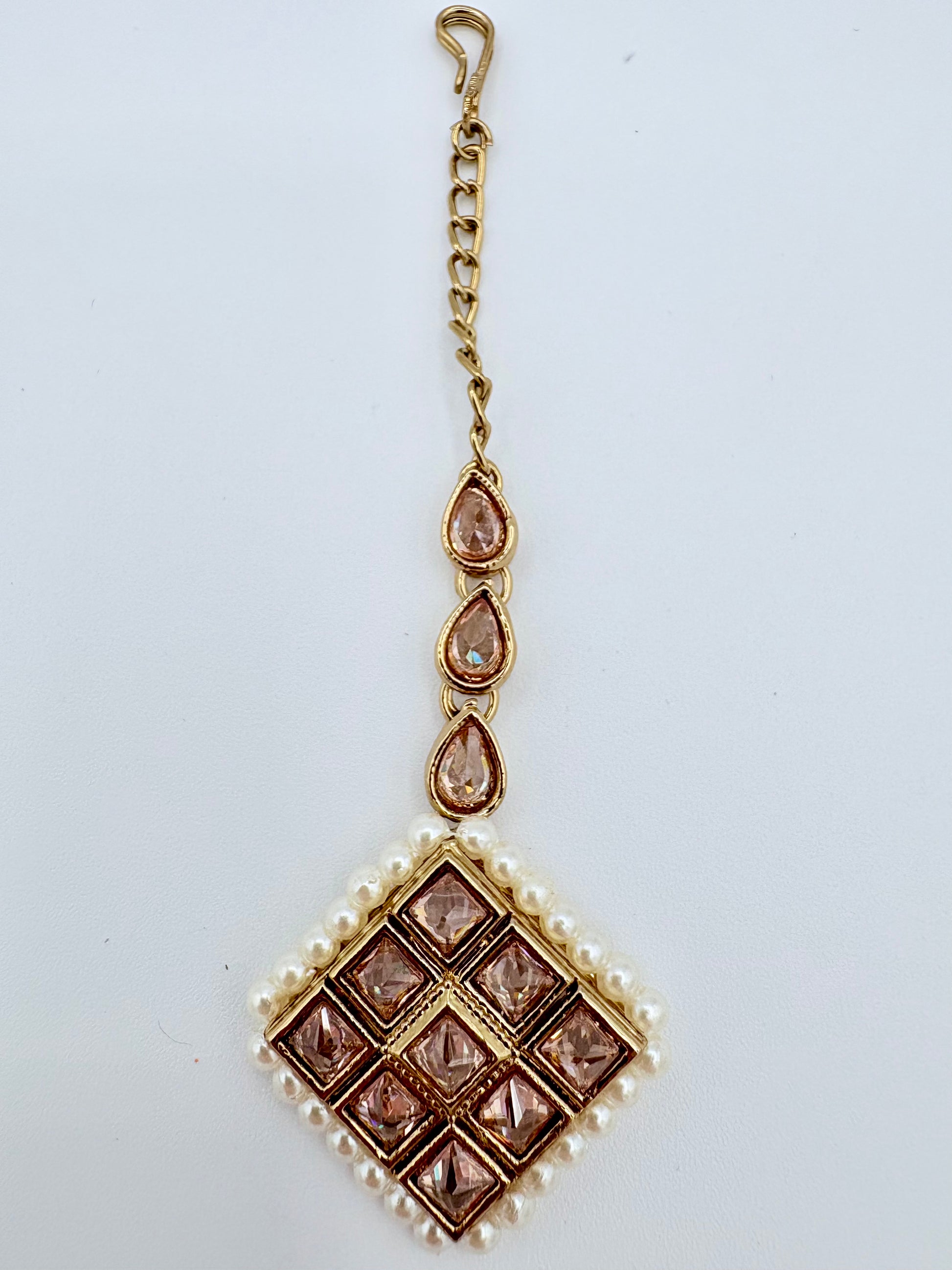 Tikka with gold chain, teardrop-shaped stones, and a square design available at Nishaani.ca – Indian jewelry in Canada