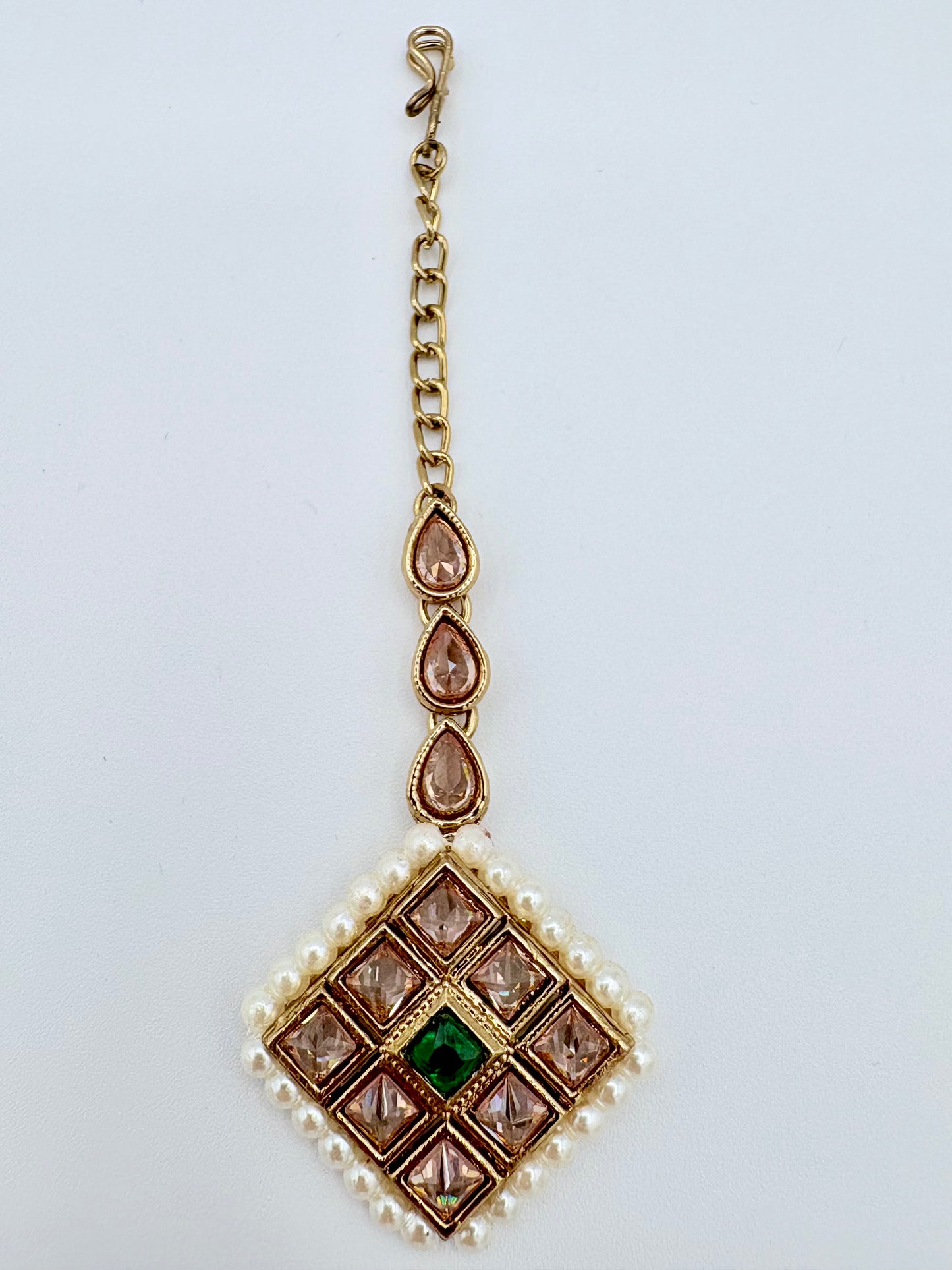 Gold tikka with green gemstone and pearl accents available at Nishaani.ca – Indian jewelry in Canada