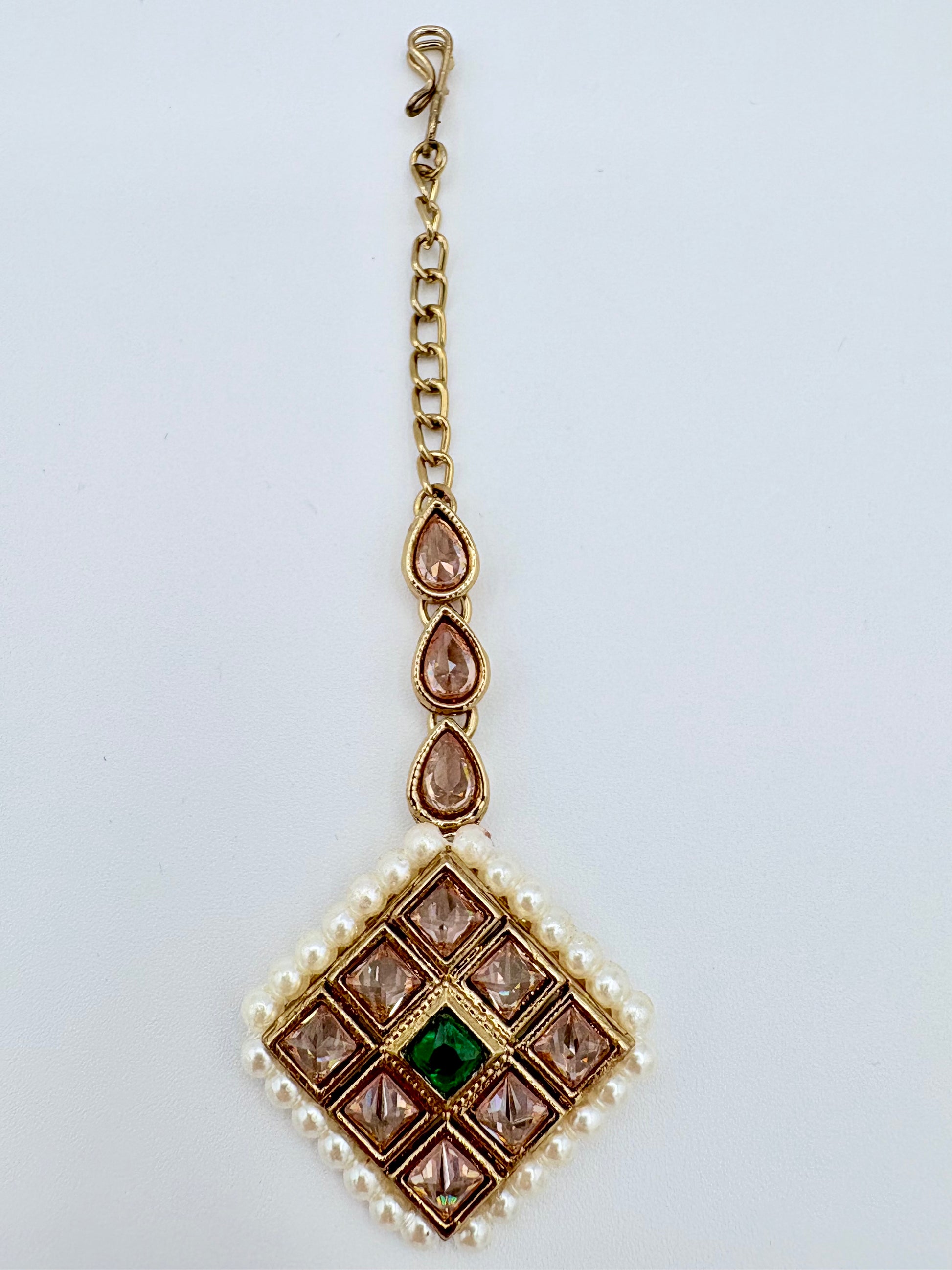 Gold tikka with green gemstone and pearl accents available at Nishaani.ca – Indian jewelry in Canada