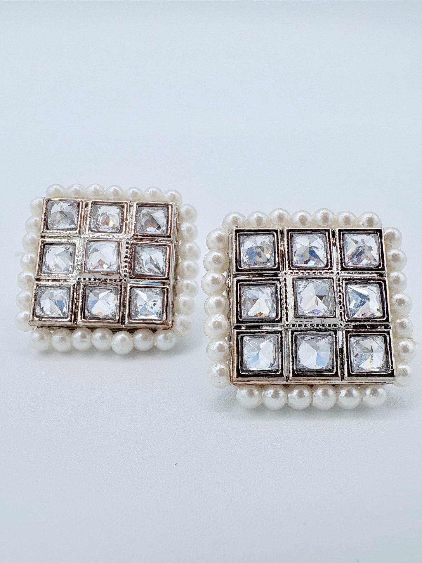 Pair of earrings with square design featuring pearls and crystals available at Nishaani.ca – Indian jewelry in Canada