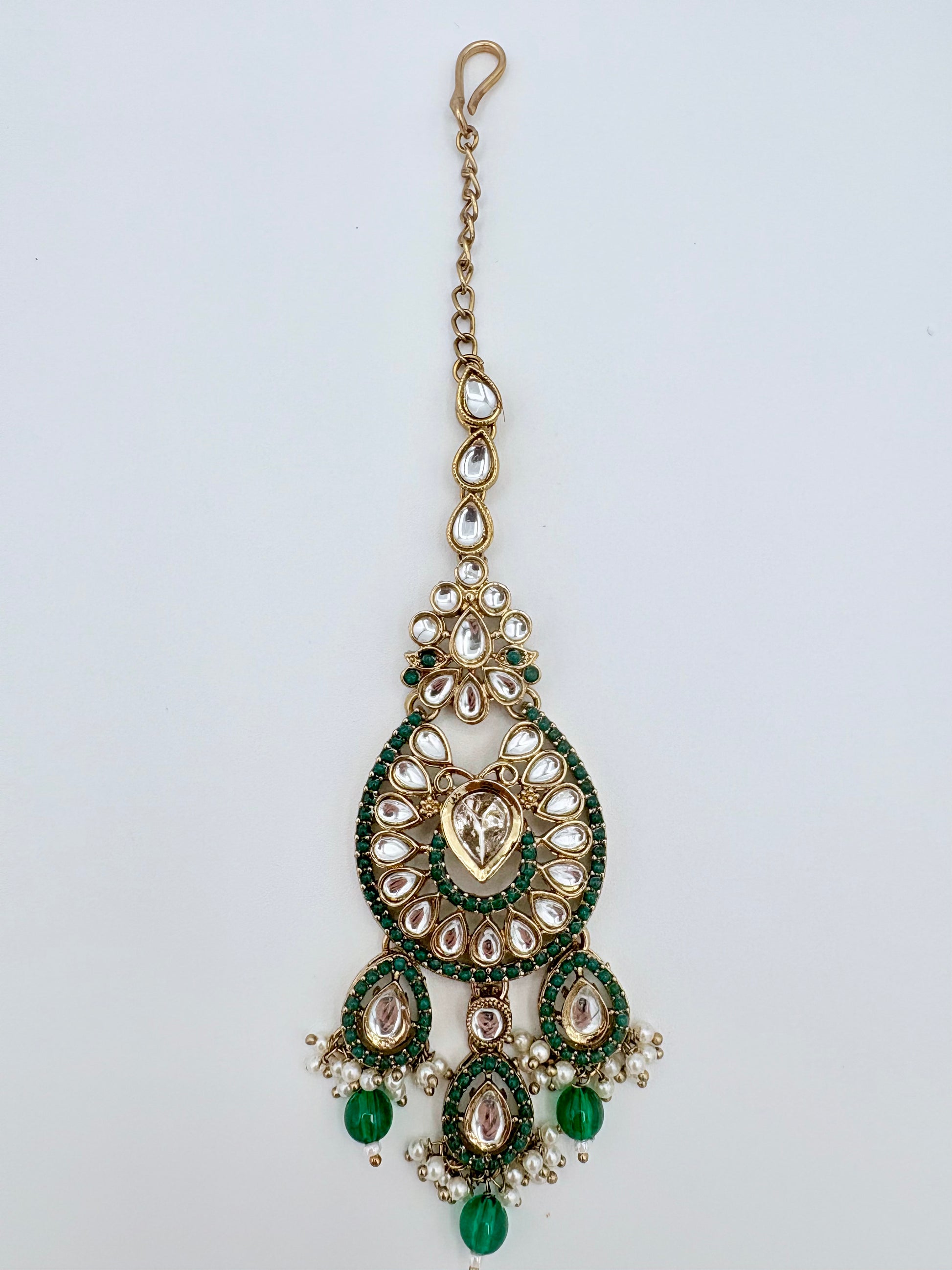 Tikka with green and gold details available at Nishaani.ca – Indian jewelry in Canada