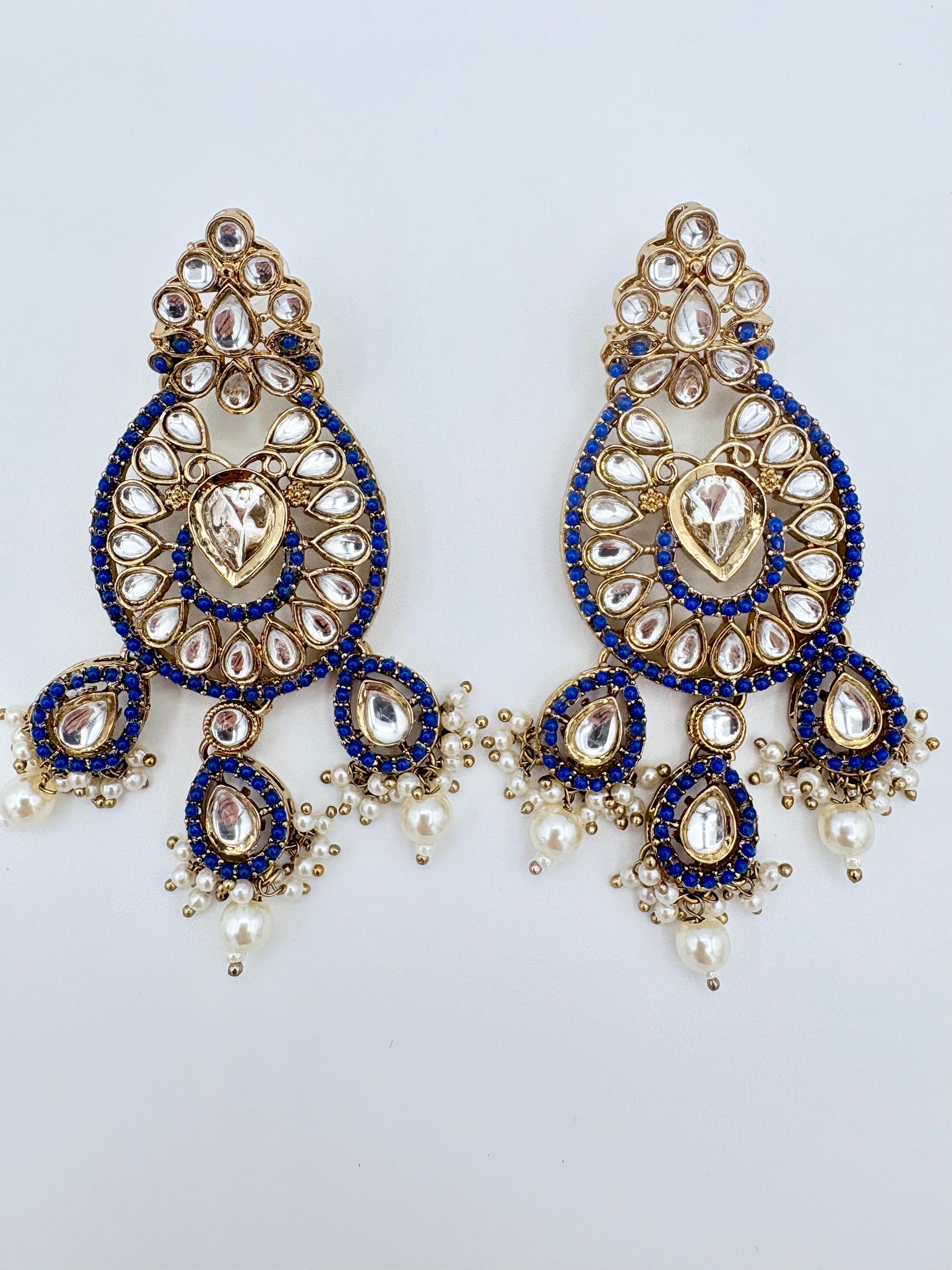 Ornate earrings with blue and gold details  available at Nishaani.ca – Indian jewelry in Canada