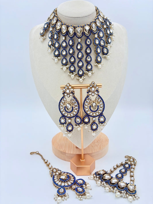 Set of blue and gold jewelry on a mannequin bust available at Nishaani.ca – Indian jewelry in Canada