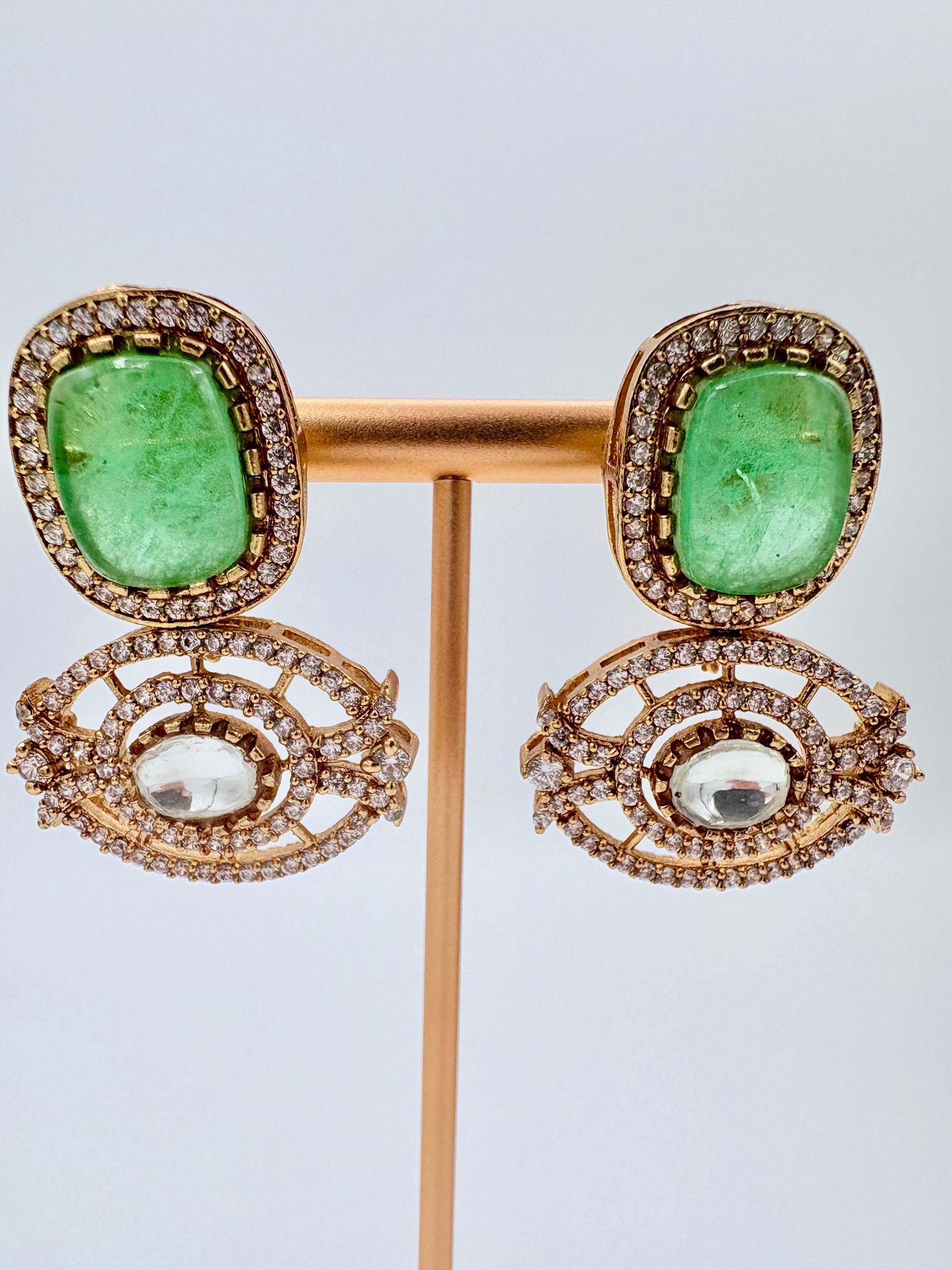 Gold earrings with green gemstones available at Nishaani.ca – Indian jewelry in Canada