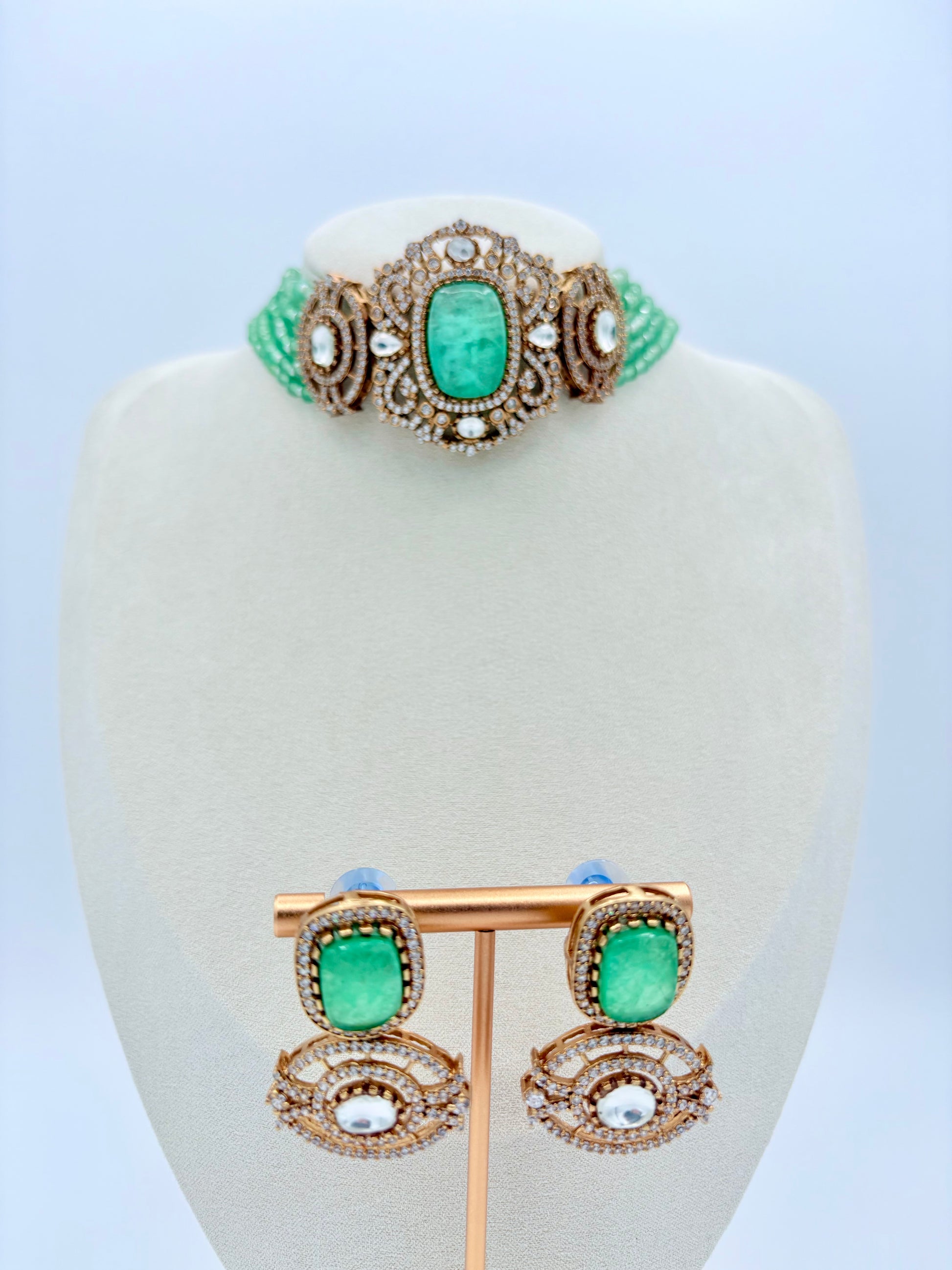 Choker necklace with green gemstones with matching earrings available at Nishaani.ca – Indian jewelry in Canada