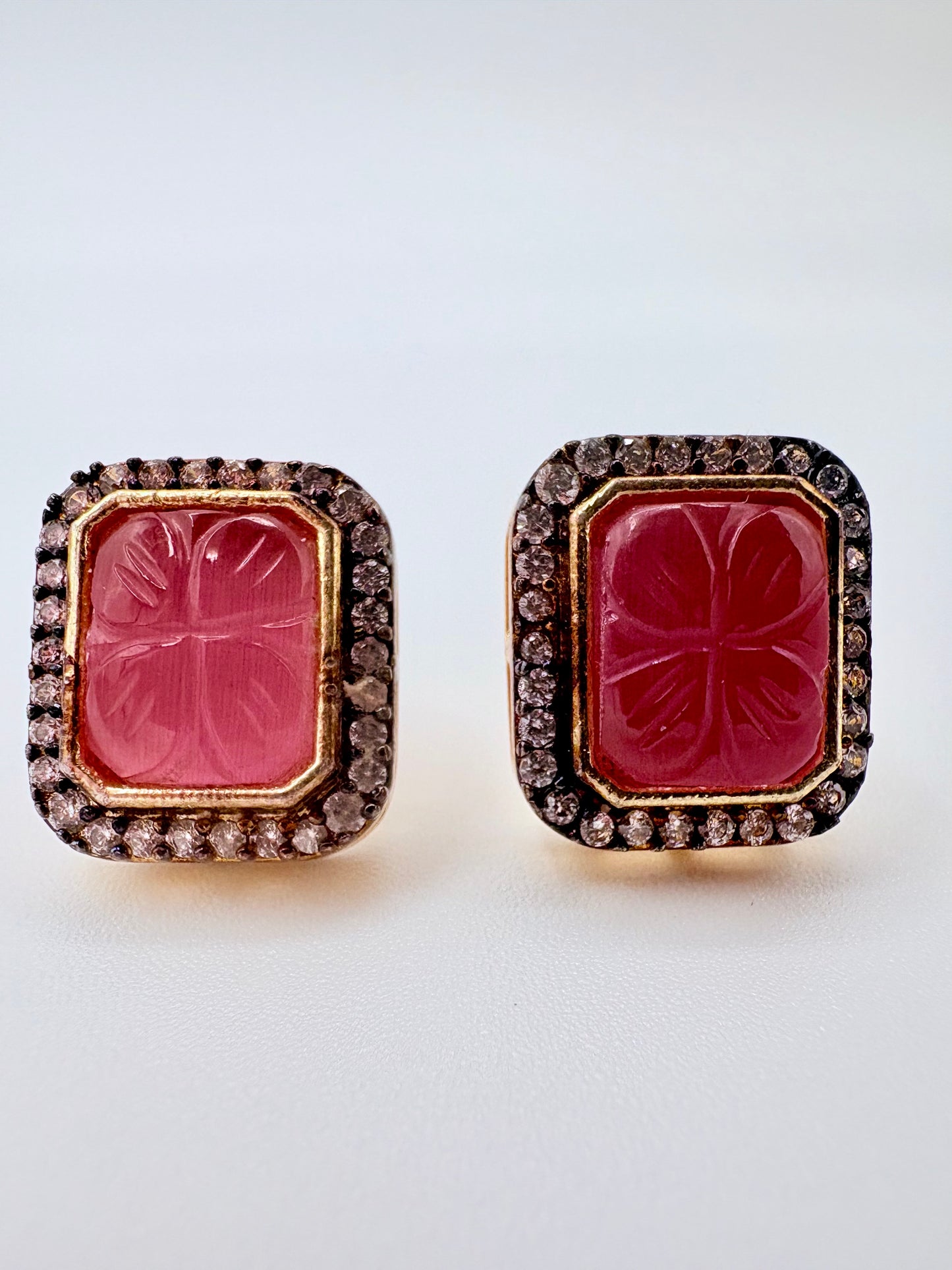 Pair of earrings with pink central stones and gold frames available at Nishaani.ca – Indian jewelry in Canada
