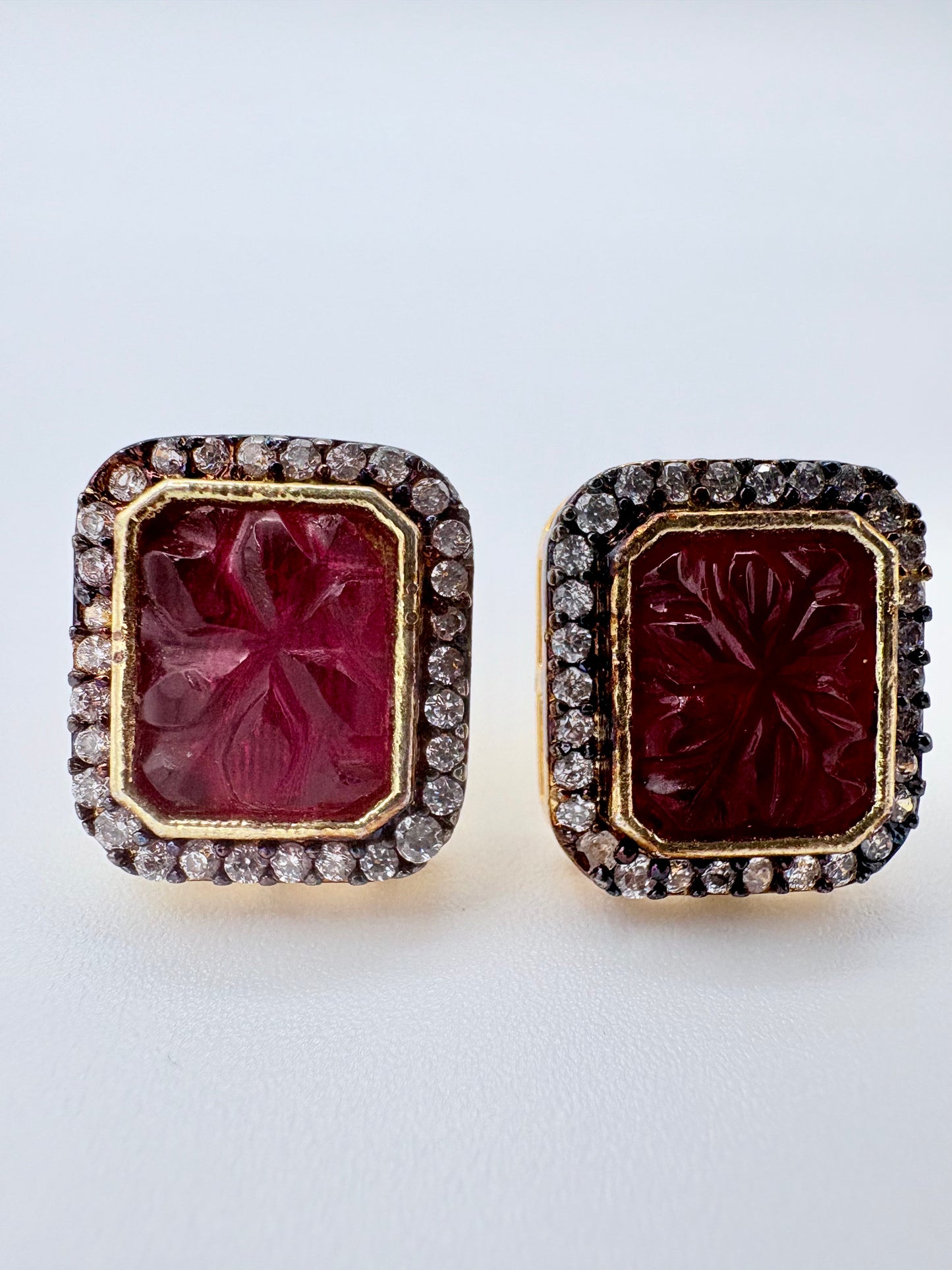 Pair of earrings with red gemstones and diamond accents available at Nishaani.ca – Indian jewelry in Canada
