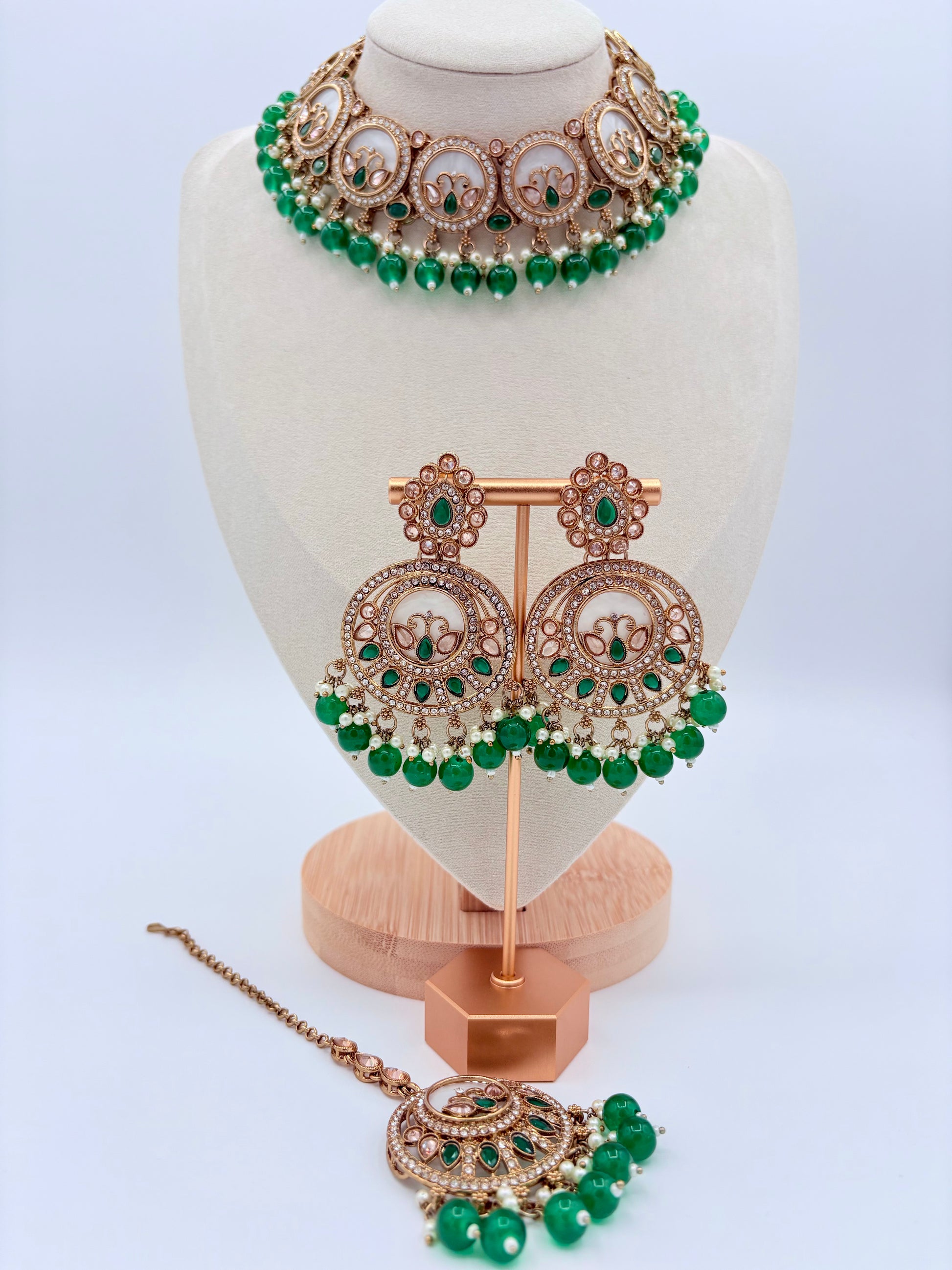 Jewelry set with necklace, earrings, and tikka on a mannequin bust available at Nishaani.ca – Indian jewelry in Canada