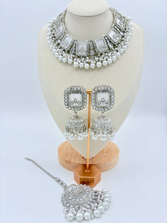 Jewelry set including necklace, earrings, and tikka on a mannequin bust available at Nishaani.ca – Indian jewelry in Canada