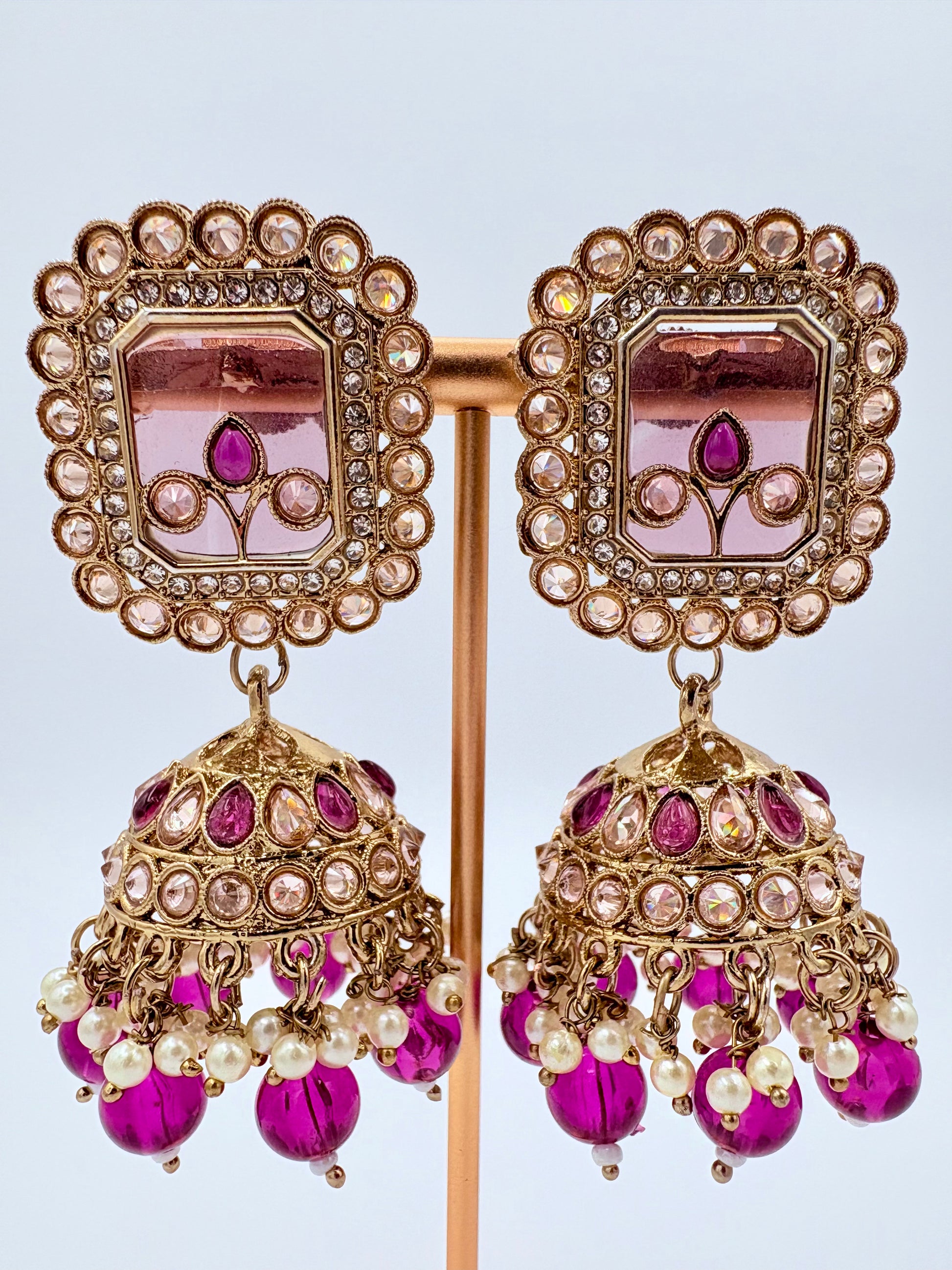 Ornate earrings with pink and gold details available at Nishaani.ca – Indian jewelry in Canada