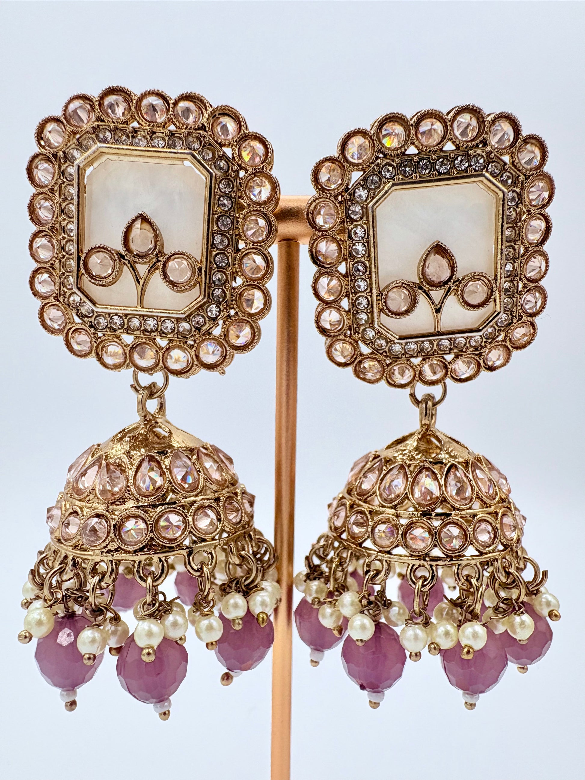 Ornate gold earrings with pink beads and pearls available at Nishaani.ca – Indian jewelry in Canada