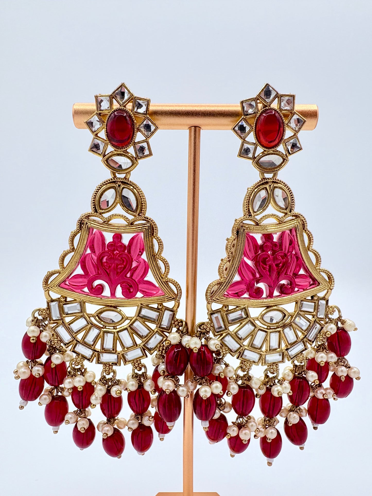 Ornate earrings with red and pink stones available at Nishaani.ca – Indian jewelry in Canada