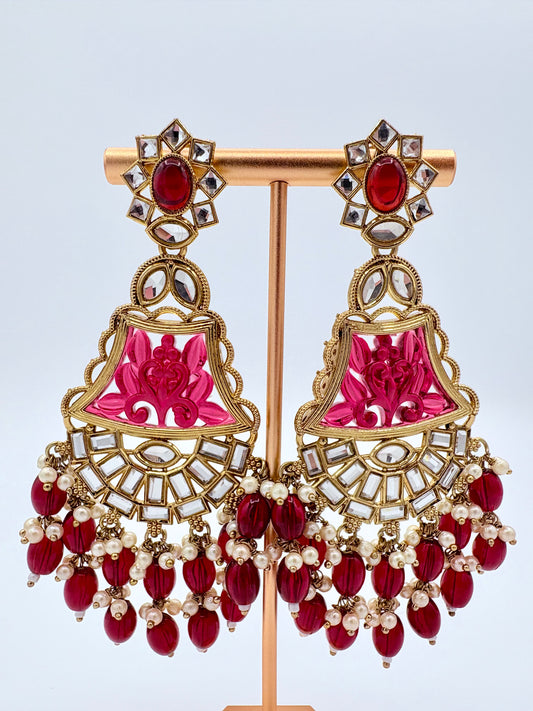 Ornate earrings with red and pink stones available at Nishaani.ca – Indian jewelry in Canada