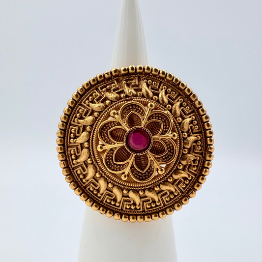 Gold ring floral design in middle with centre is red ruby available at Nishaani.ca – Indian jewelry in Canada