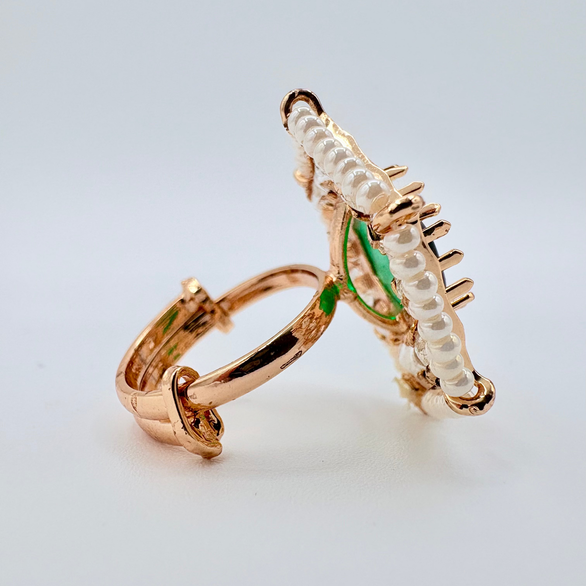 Gold ring with green accents available at Nishaani.ca – Indian jewelry in Canada