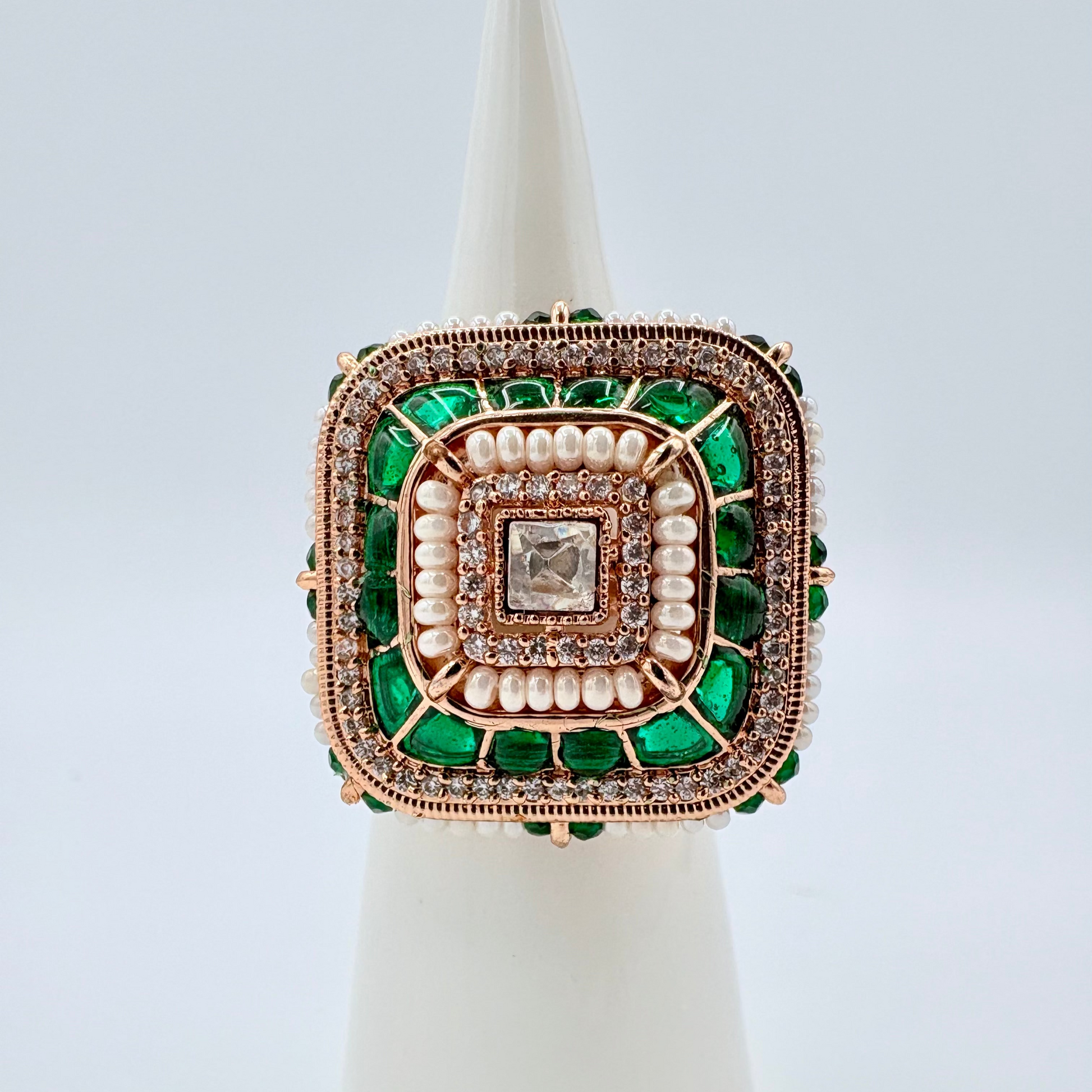 Decorative ring with green and rose gold accents available at Nishaani.ca – Indian jewelry in Canada