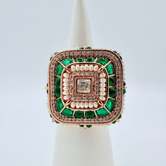 Decorative ring with green and rose gold accents available at Nishaani.ca – Indian jewelry in Canada