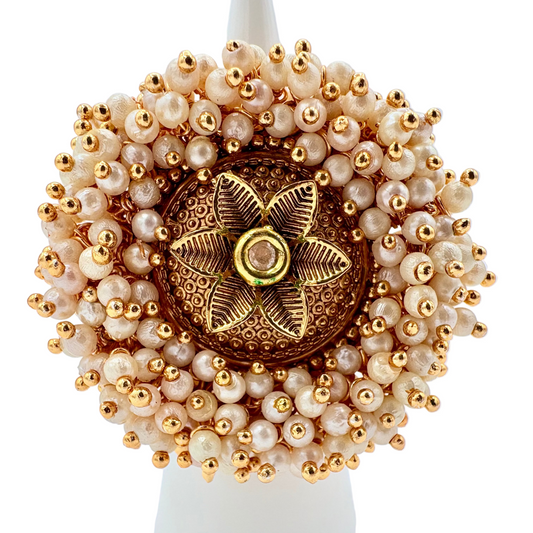 Indian adjustable ring with gold and beige beads centre gold flower available at Nishaani.ca – Indian jewelry in Canada