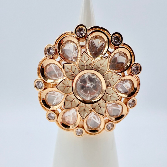 Gold ring with diamond like gems gold flower in the middle available at Nishaani.ca – Indian jewelry in Canada