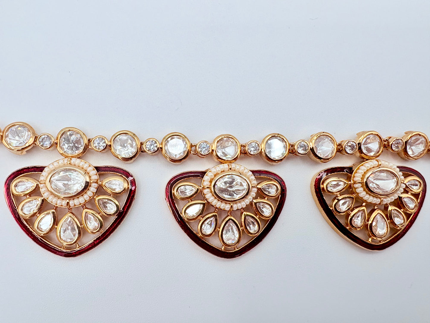 Decorative jewelry piece with heart-shaped elements and crystal-like stonesavailable at Nishaani.ca – Indian jewelry in Canada