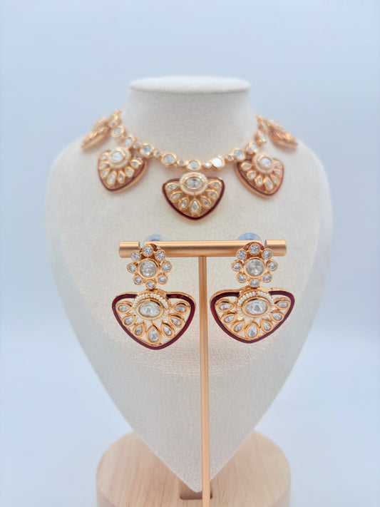 Gold and red jewelry set on a mannequin bust available at Nishaani.ca – Indian jewelry in Canada 