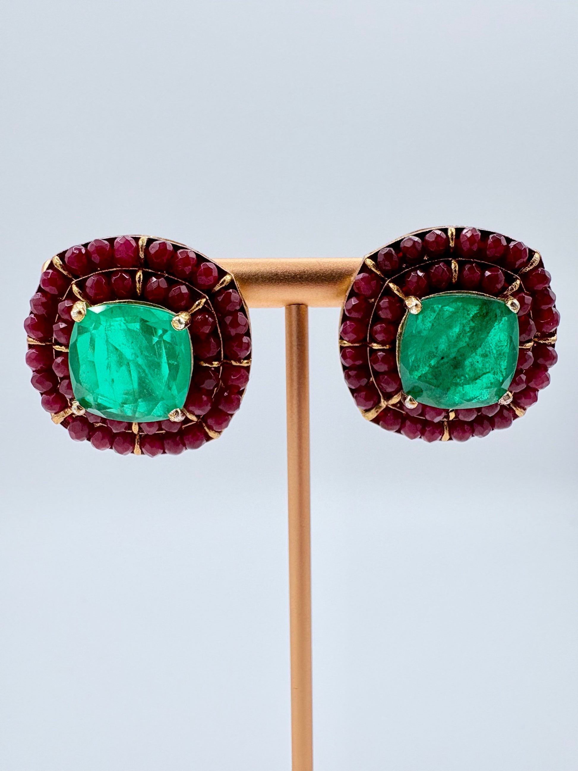 Pair of earrings with green gemstones and red beads available at Nishaani.ca – Indian jewelry in Canada