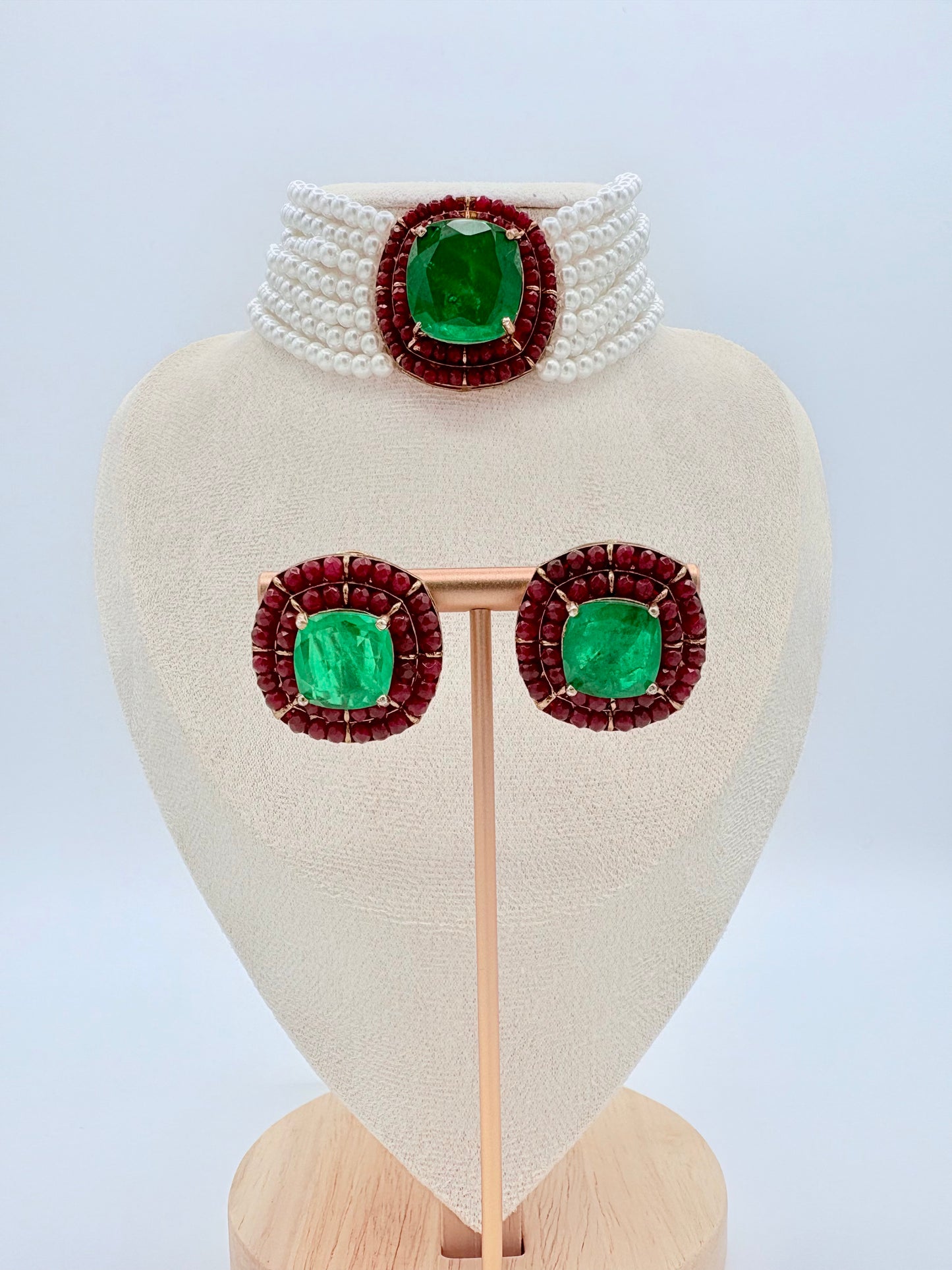 Jewelry set with green gemstones and red accents available at Nishaani.ca – Indian jewelry in Canada