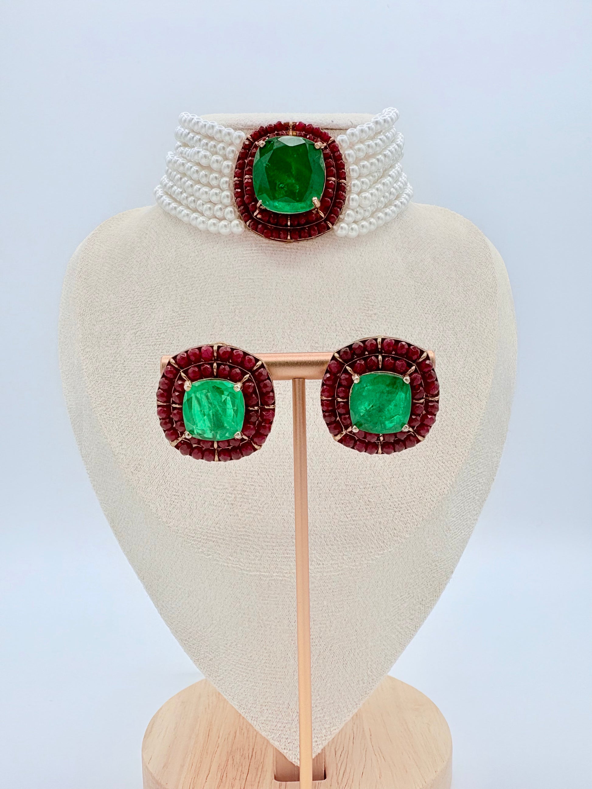 Jewelry set with green gemstones and red accents available at Nishaani.ca – Indian jewelry in Canada