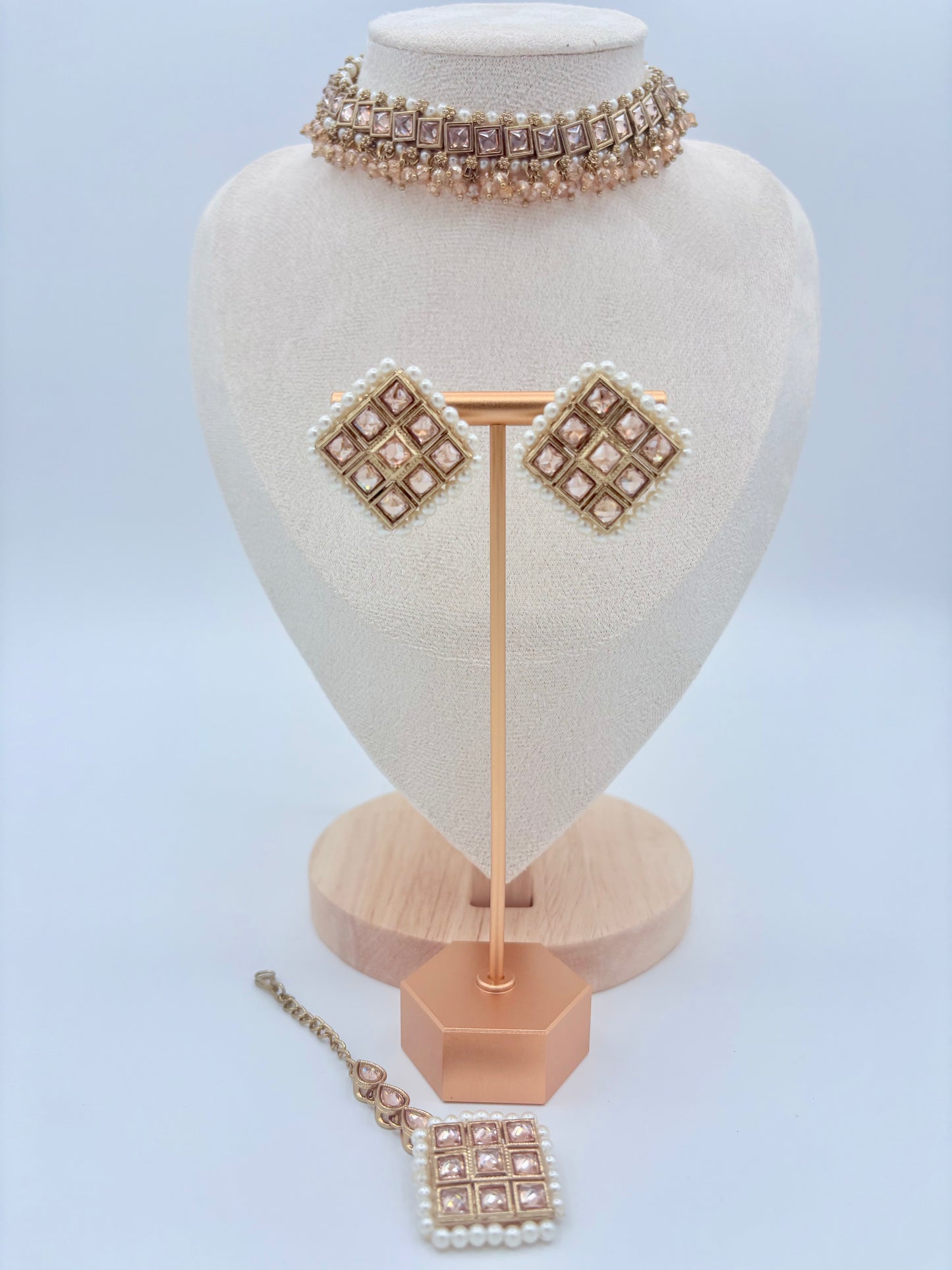 Choker Jewelry set including a necklace, choker, and earrings on a mannequin bust available at Nishaani.ca – Indian jewelry in Canada